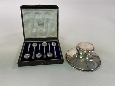 Lot 1023 - A hallmarked silver capstan type inkwell,...