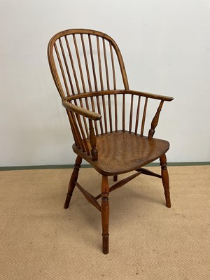 Lot 649 - A 19th century stick back Windsor elbow chair.