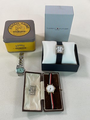 Lot 1308 - Three boxed wristwatches, comprising Fossil,...
