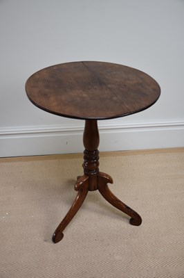 Lot 1198 - An early 19th century oak tripod, with...
