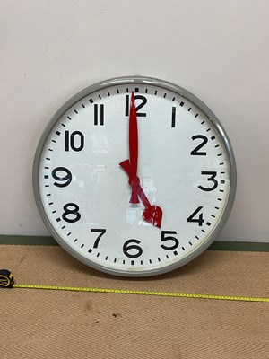 Lot 1339 - A mid 20th century industrial wall clock, with...