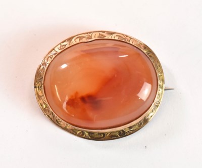 Lot 1199 - A 9ct yellow gold carnelian oval brooch, width...