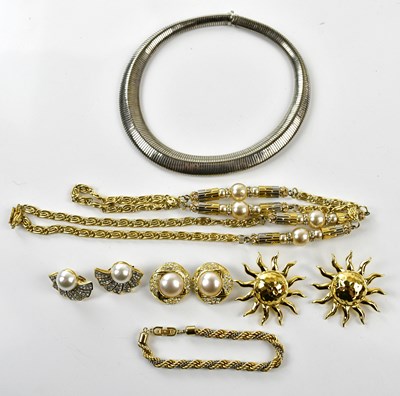 Lot 932 - NINA RICCI; a gold and silver tone twist...