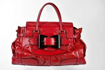 Lot 738 - GUCCI; a bright red coated canvas and leather...