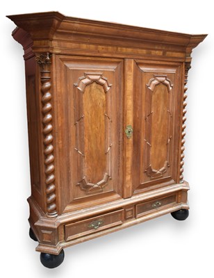 Lot 1010 - A large oak and walnut armoire with moulded...