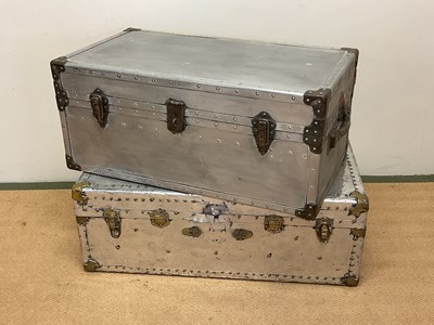 Lot 622 - Two aluminium travelling trunks with rivet...