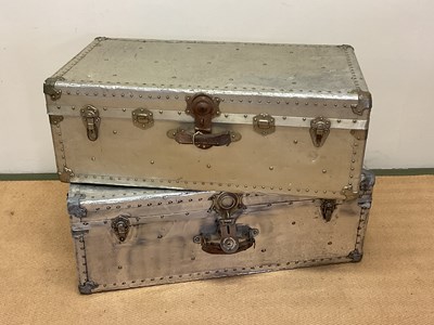 Lot 623 - Two aluminium travelling trunks with rivet...