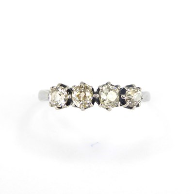 Lot 954 - An 18ct white gold ring, the head set with...
