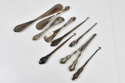 Lot 2173 - A collection of nine white metal and silver...