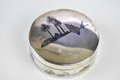Lot 2166 - An Indian white metal and niello circular box...