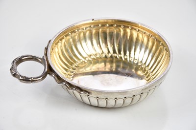 Lot 2167 - A French white metal wine taster, with loop...
