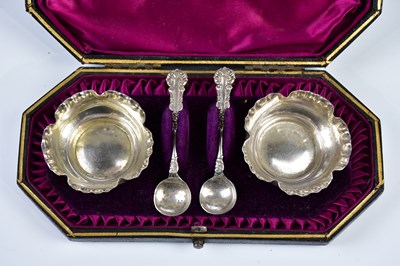 Lot 2514 - A cased pair of Victorian silver salts, London...