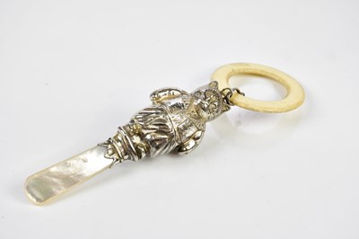 Lot 2128 - A hallmarked silver cat rattle, Chester 1959,...