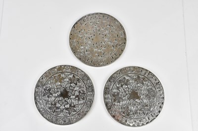 Lot 2204 - Three white metal mounted glass coasters,...