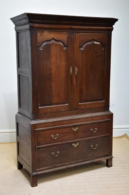 Lot 1171 - An 18th century oak cupboard chest, with two...