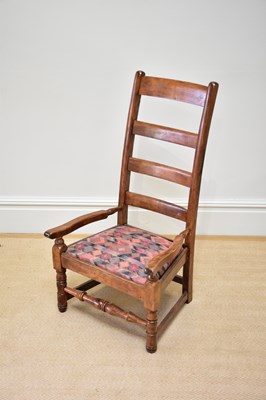 Lot 1097 - A 19th century ladderback elbow chair with...