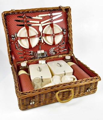 Lot 1305 - A vintage wicker picnic set.