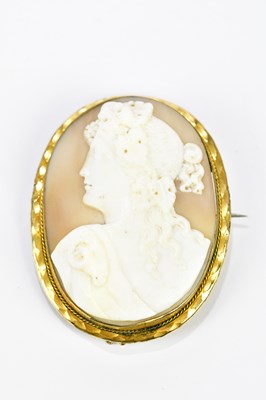 Lot 381 - A late Victorian oval carved cameo brooch in...