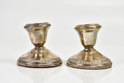 Lot 2537 - A pair of sterling silver weighted squat...