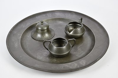 Lot 1428 - A 19th century pewter charger with touch marks,...