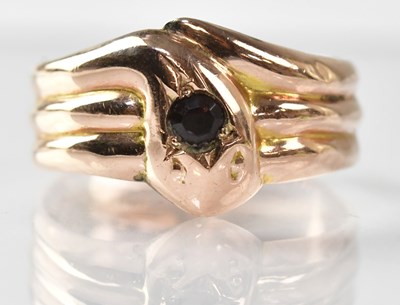 Lot 730 - A 9ct yellow gold snake ring, the head set...