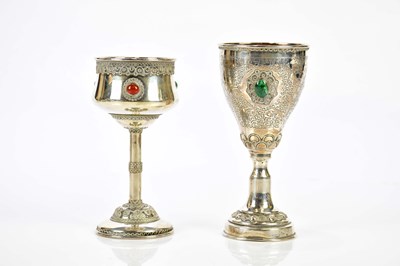 Lot 2476 - Two Israeli sterling silver goblets set with...