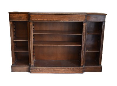 Lot 26 - A reproduction oak breakfront bookcase of...
