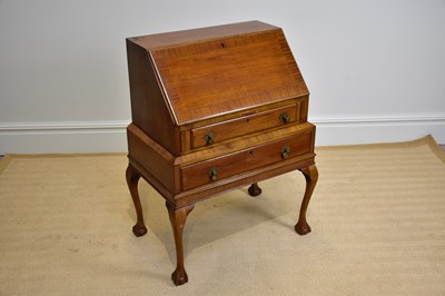 Lot 1042 - A mahogany bureau, with fall above two drawers,...