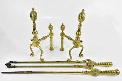 Lot 1429 - A pair of late 19th century cast brass fire...