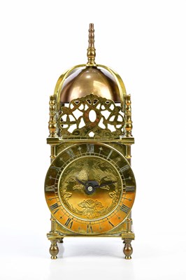 Lot 1510 - BUTT & CO; a brass mantel timepiece modelled...