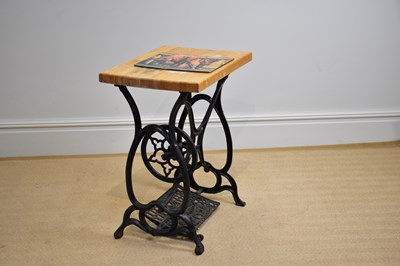 Lot 1079 - ECLIPSE; a cast iron sewing machine table base,...