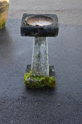 Lot 1233 - A reconstituted stone bird bath, height 70cm.