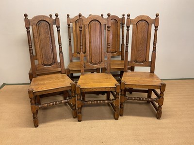 Lot 675 - A set of six oak dining chairs with panel...