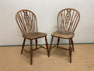Lot 717 - A pair of elm wheel back dining chairs, height...