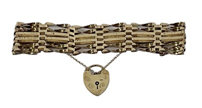 Lot 1460 - A 9ct yellow gold gate link bracelet, with...