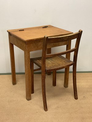 Lot 693 - A vintage school desk and chair.