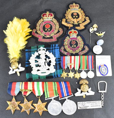 Lot 605 - A WWII medal group, badges and ephemera...