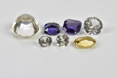 Lot 489 - Seven loose gemstones including an oval...