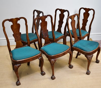 Lot 1043 - A set of six Queen Anne style walnut dining...