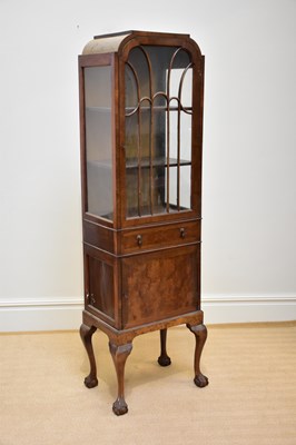 Lot 1069 - An early 20th century walnut display cabinet...