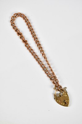 Lot 1190 - A 9ct rose gold curb link bracelet with 9ct...