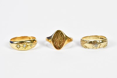 Lot 1192 - Two 9ct yellow gold rings, one with engraved...
