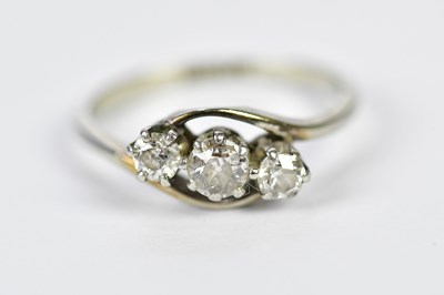 Lot 1194 - An 18ct yellow gold and platinum tipped three...