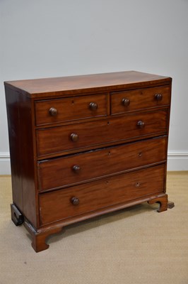 Lot 1068 - An early 19th century mahogany chest, with two...