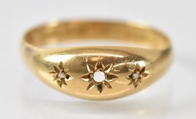 Lot 1462 - An 18ct yellow gold three stone diamond ring...