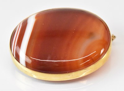 Lot 1541 - A 9ct yellow gold mounted hardstone set brooch,...