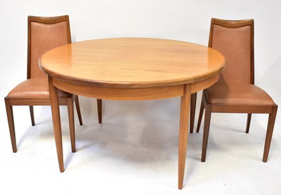 Lot 6 - G-PLAN; a circular extending dining table,...