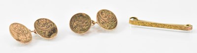 Lot 1491 - A pair of 9ct yellow gold cufflinks and a 9ct...