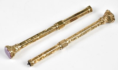 Lot 1361 - Two Victorian yellow metal propelling pencils,...