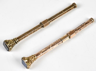 Lot 1364 - Two Victorian yellow metal propelling pencils...